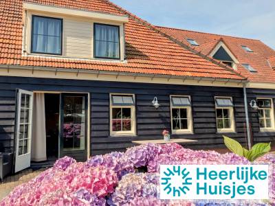 Comfortabel 8-persoons appartement met sauna en sfeerhaard op kindvriendelijk terrein