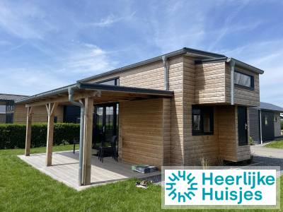 Knus tiny house voor 4 personen met smart-tv en kachel op rustig Noord-Hollands park